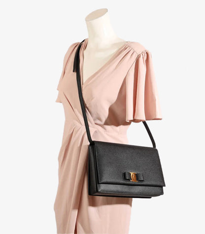Salvatore Ferragamo Vara Bow crossbody bag worn on mannequin