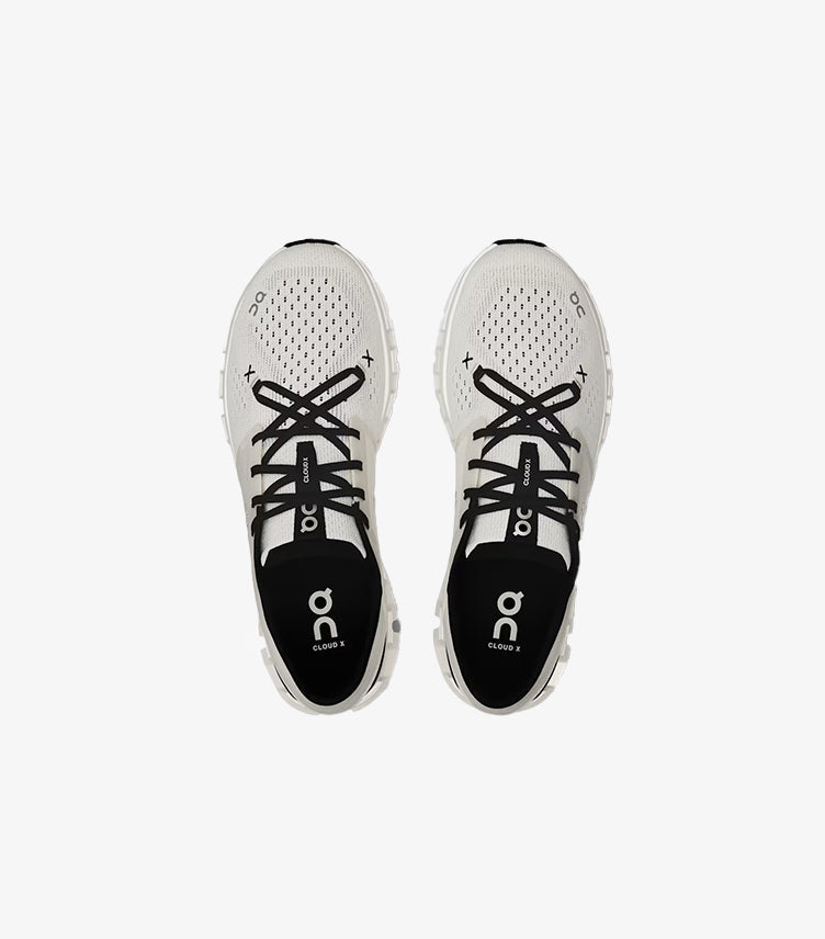 Top view of On Running Cloud X lace-up trainers showing breathable perforated uppers and branded insoles
