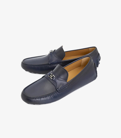 Angled view of Ferragamo navy leather driving shoes with silver Gancini hardware