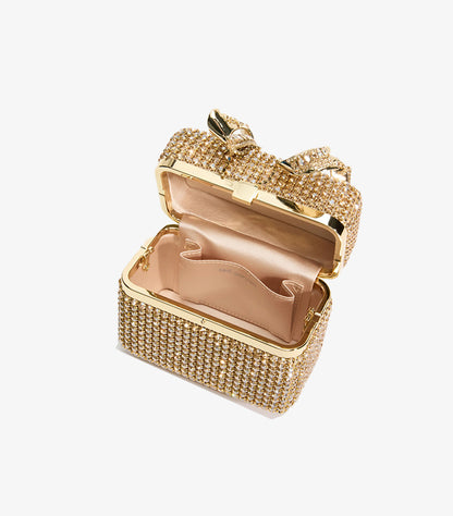 Open Self-Portrait gold crystal clutch showing satin-lined interior