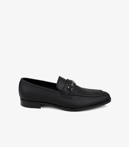 Black leather slip-on loafers front view with apron toe stitching