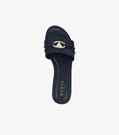 Top view of Guess women’s navy flat sandal featuring gold logo hardware and square toe