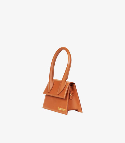 Angled side view of Jacquemus luxury leather mini handbag showcasing structured silhouette.