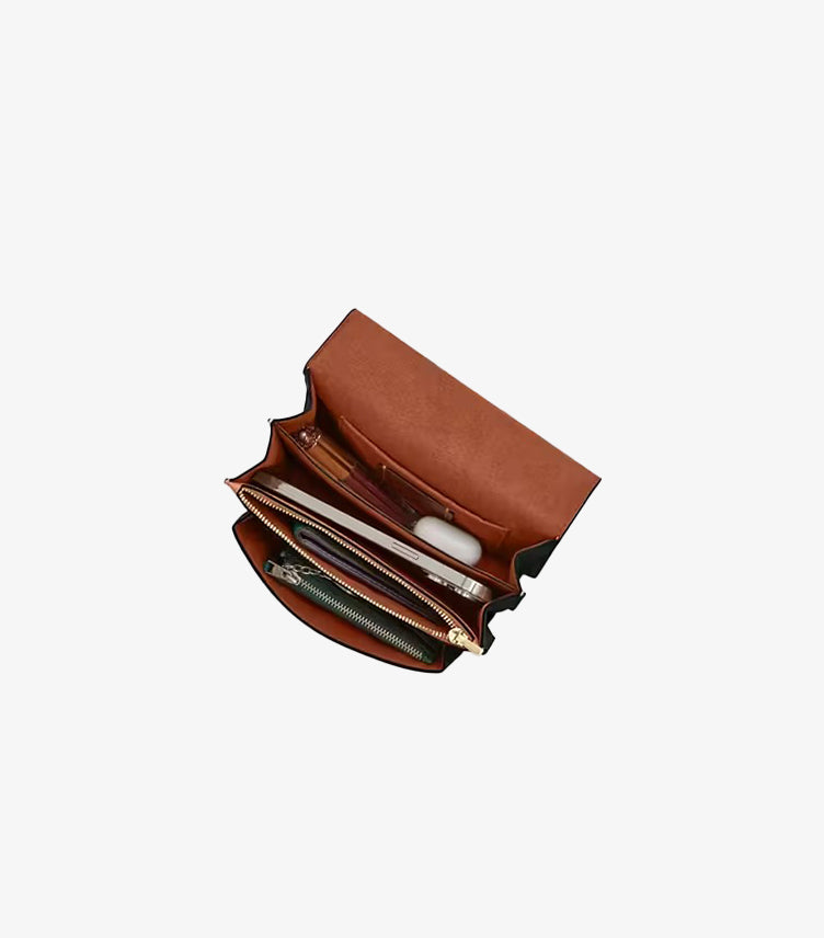 Interior of Coach Mini Klare crossbody showing multifunction pockets zip pocket and fabric lining