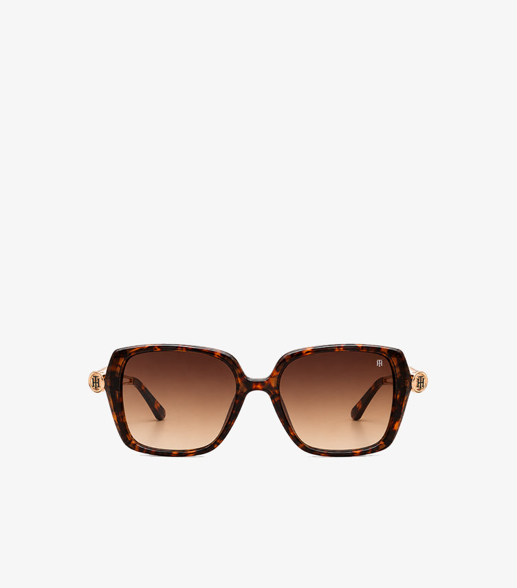 Front view of Tommy Hilfiger oversized square sunglasses featuring tortoiseshell frames, gradient lenses and TH monogram accents