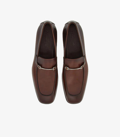 Ferragamo brown burnished Gancini Bit loafers top-down pair view showing silver bit hardware and FERRAGAMO branded insole