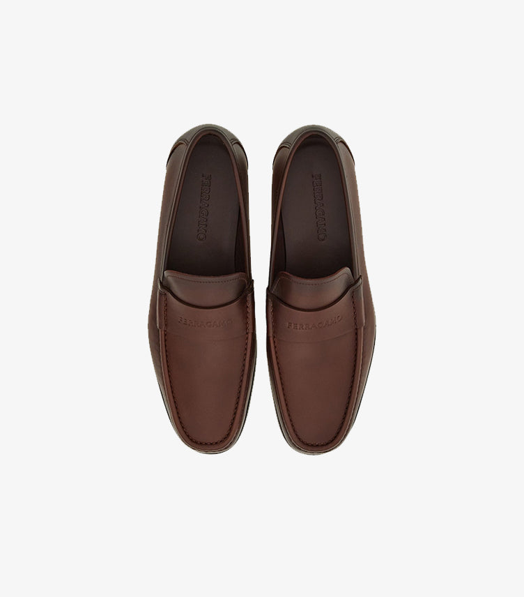 Top view of Ferragamo men’s dark brown leather penny loafers
