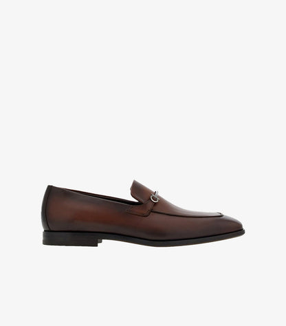 Ferragamo Gancini Bit loafer brown burnished leather side profile showing low stacked heel and slip-on silhouette