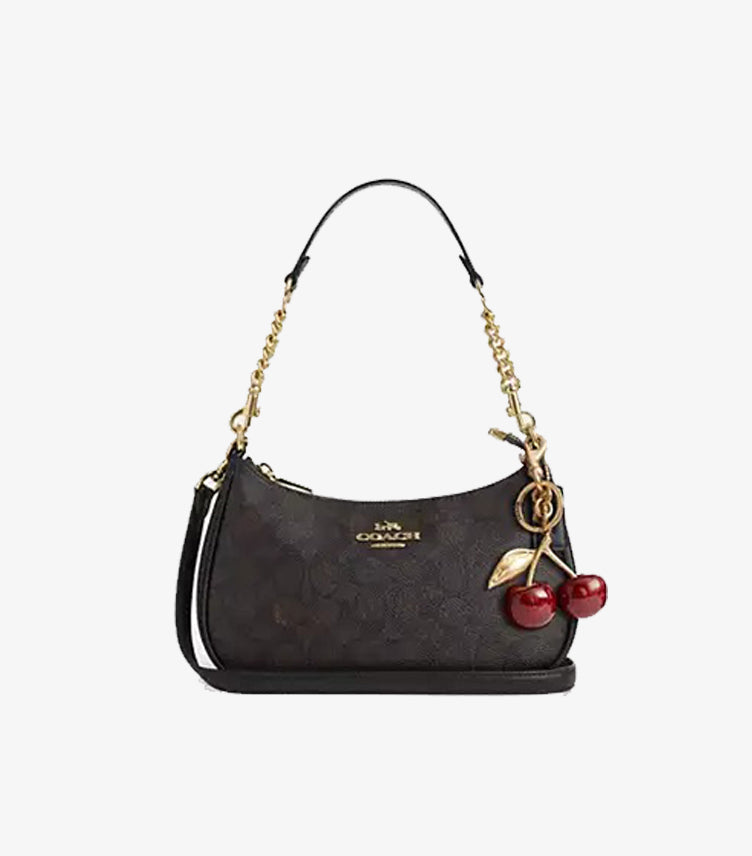 Detachable handle on Coach Teri Signature canvas bag showing 8.5 inch drop