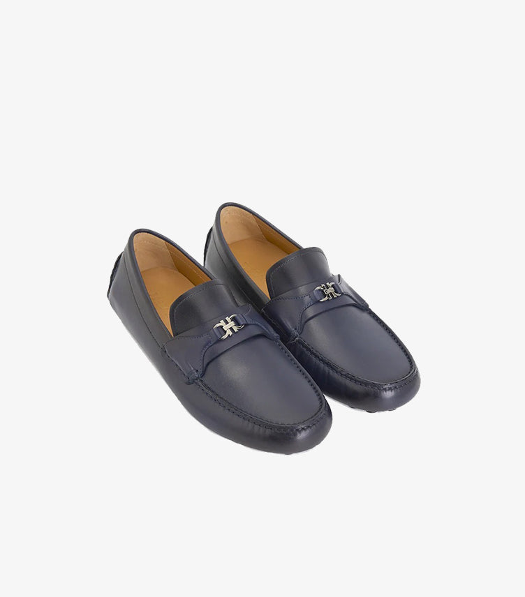 Front three-quarter view of Ferragamo men’s navy blue slip-on loafers