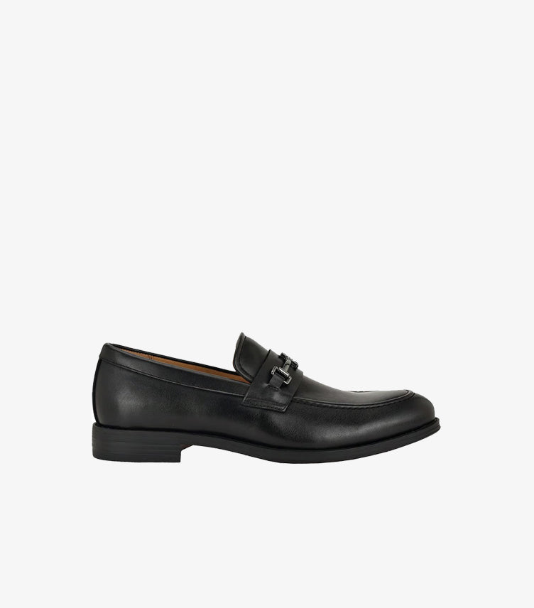 Side view of Tommy Hilfiger men's black leather loafers featuring horsebit hardware and durable rubber outsole.