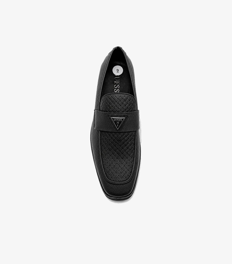 Top view of Guess men’s black slip-on loafer with textured vamp and branded penny strap