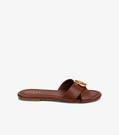 GUESS Los Angeles brown cross-strap flat slide sandal side profile showing square toe and gold logo hardware