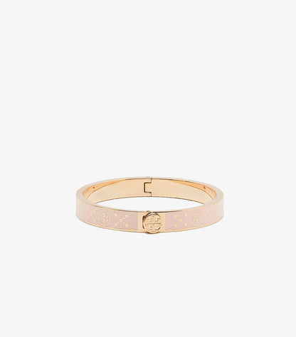 Front view of Tory Burch blush-pink enamel hinged bangle with gold-tone lattice pattern and Double T logo