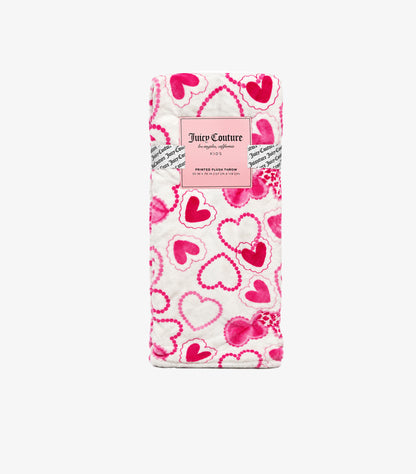 Folded Juicy Couture pink heart print plush throw blanket in branded packaging showing 50 x 70 inch dimensions