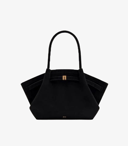 Front product view of JW PEI Hana medium faux-suede handbag with dual handles and winged construction