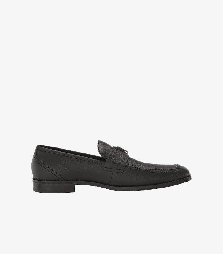 Rubber outsole of GUESS men's black dress loafer