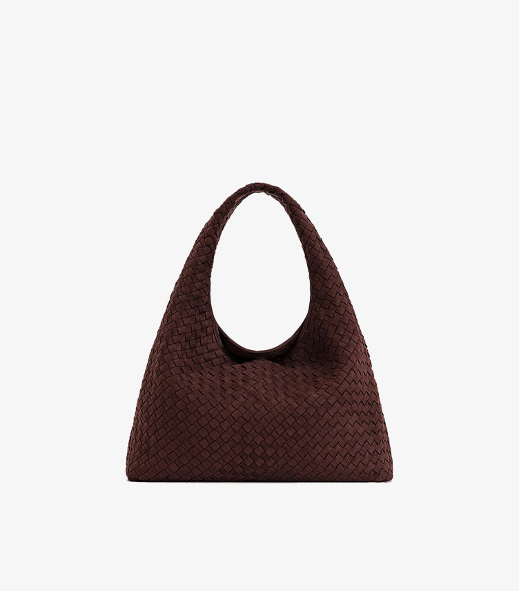Front view of JW PEI woven tote bag with a wide integrated shoulder strap and curved top opening