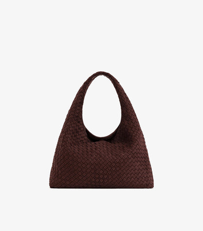 Front view of JW PEI woven tote bag with a wide integrated shoulder strap and curved top opening