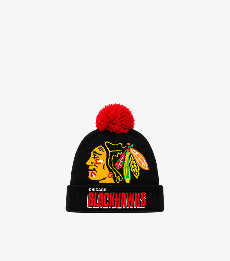 Front view of NHL Chicago Blackhawks black knitted beanie with embroidered team crest, logo cuff and red pom-pom