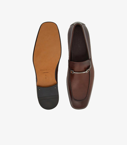 Ferragamo Gancini Bit loafer brown burnished leather top view alongside full leather sole stamped FERRAGAMO Made in Italy