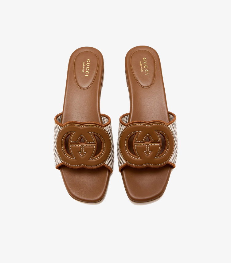 Gucci tan canvas Interlocking G flat slides top view pair showing GG logo cutout and GUCCI Made in Italy insole