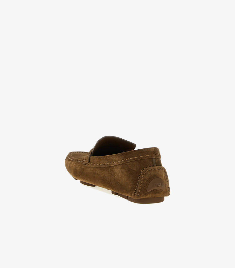 Rear side view of Fendi suede leather loafers showcasing handcrafted stitching and flexible driving sole.