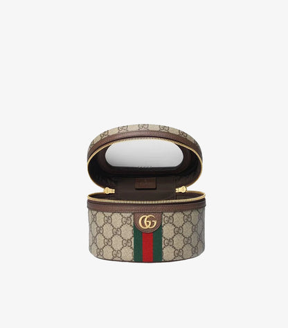 Open Gucci Ophidia cosmetic vanity case displaying the interior compartment and mirror inside the lid