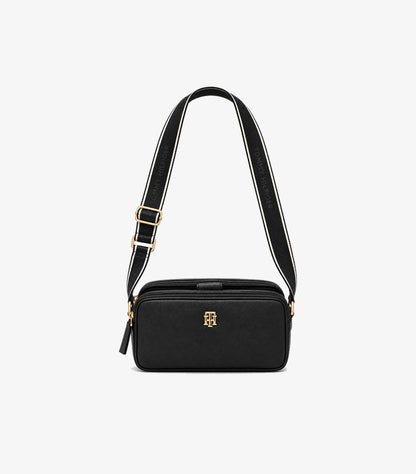 Front view of Tommy Hilfiger crossbody camera bag with gold-tone TH monogram and branded webbing strap