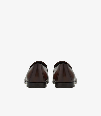 Ferragamo brown burnished leather Gancini Bit loafers back view showing heel construction and gradient finish