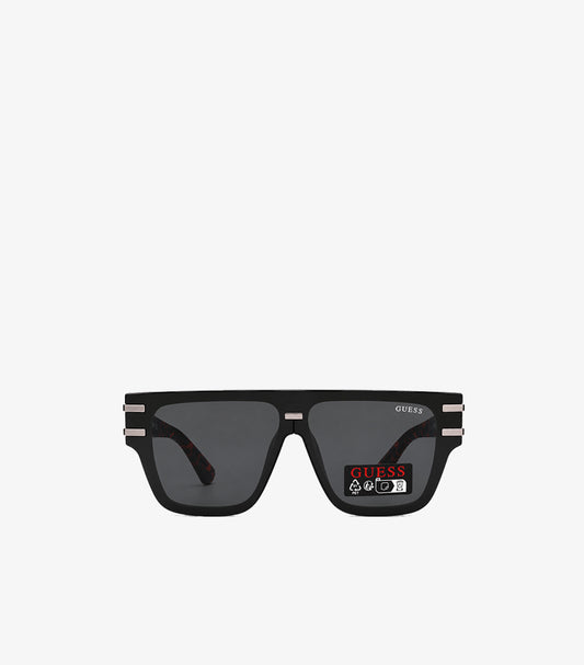 GUESS men's black square flat-top sunglasses front view showing smoke grey lenses silver hardware and GUESS branding on lens