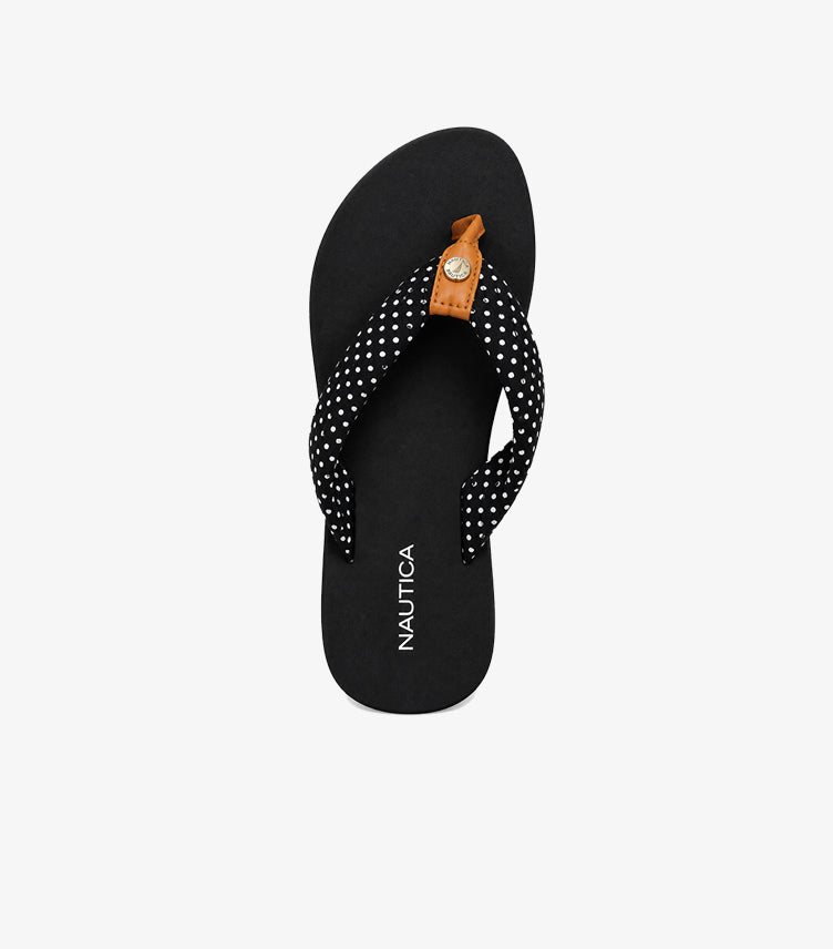 Top view of Nautica women’s black polka dot flip-flop sandals showing thong straps and contrasting toe-post details