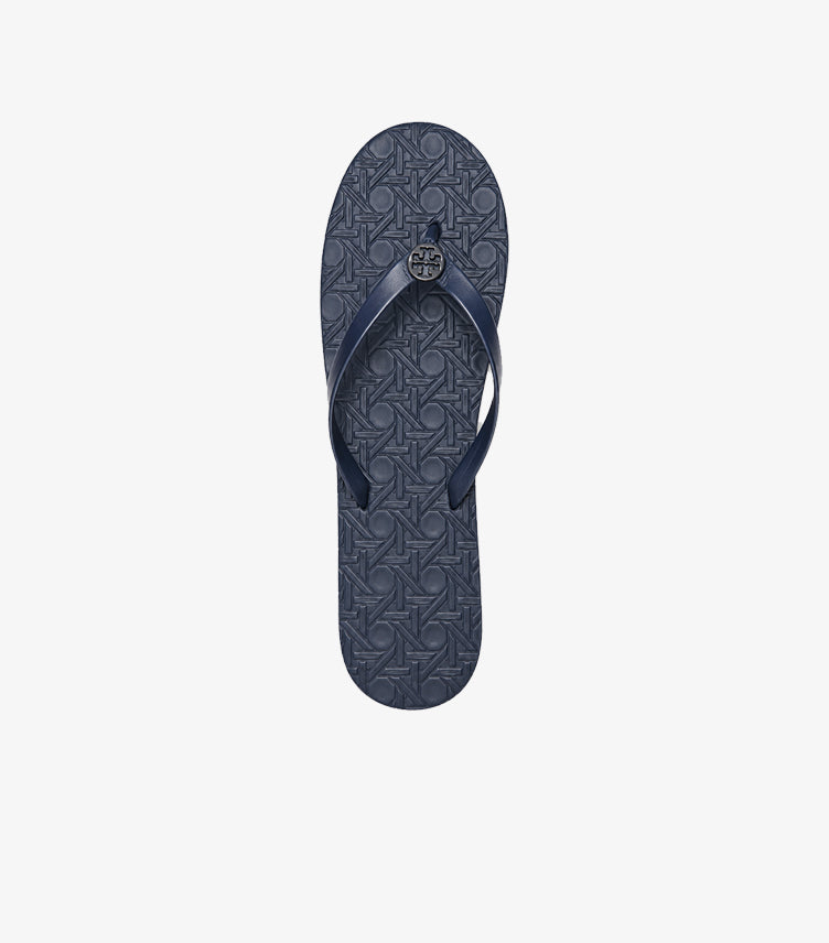 Top view of Tory Burch women’s navy blue flip-flop with textured footbed and Double T logo
