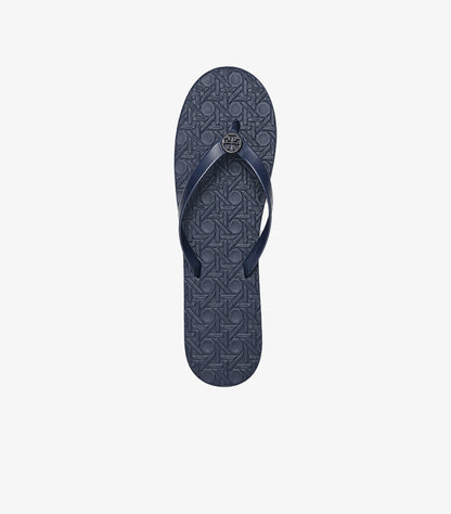 Top view of Tory Burch women’s navy blue flip-flop with textured footbed and Double T logo