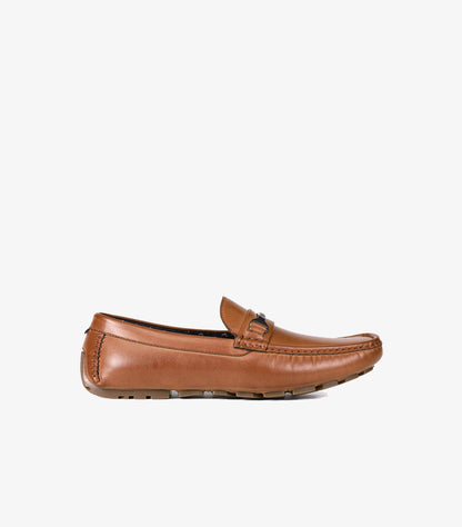 Side view of Tommy Hilfiger brown leather driving loafer with moccasin stitching, low heel and flexible sole
