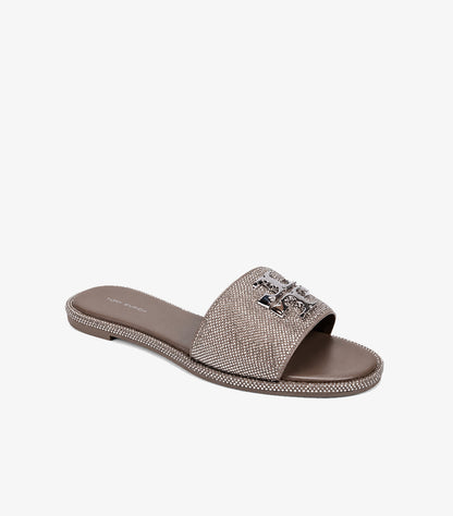 Tory Burch Eleanor crystal embellished flat slides taupe angled view showing rhinestone strap crystal-studded sole border and silver T logo