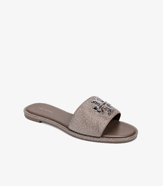 Tory Burch Eleanor crystal embellished flat slides taupe angled view showing rhinestone strap crystal-studded sole border and silver T logo